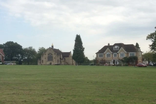 Highfield Oval green with the chapel and campus buildings beyond